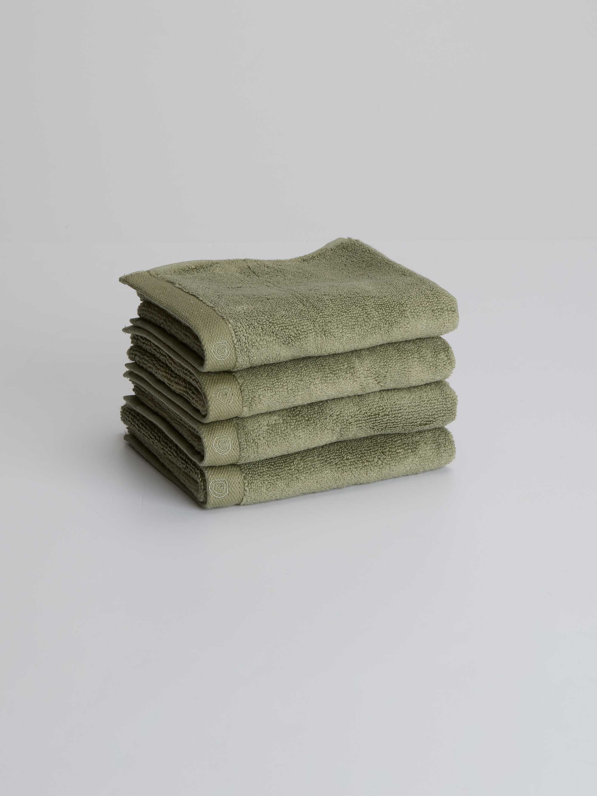TAKEANAP bamboo zero-twist bath towel in sage green on a shelf
