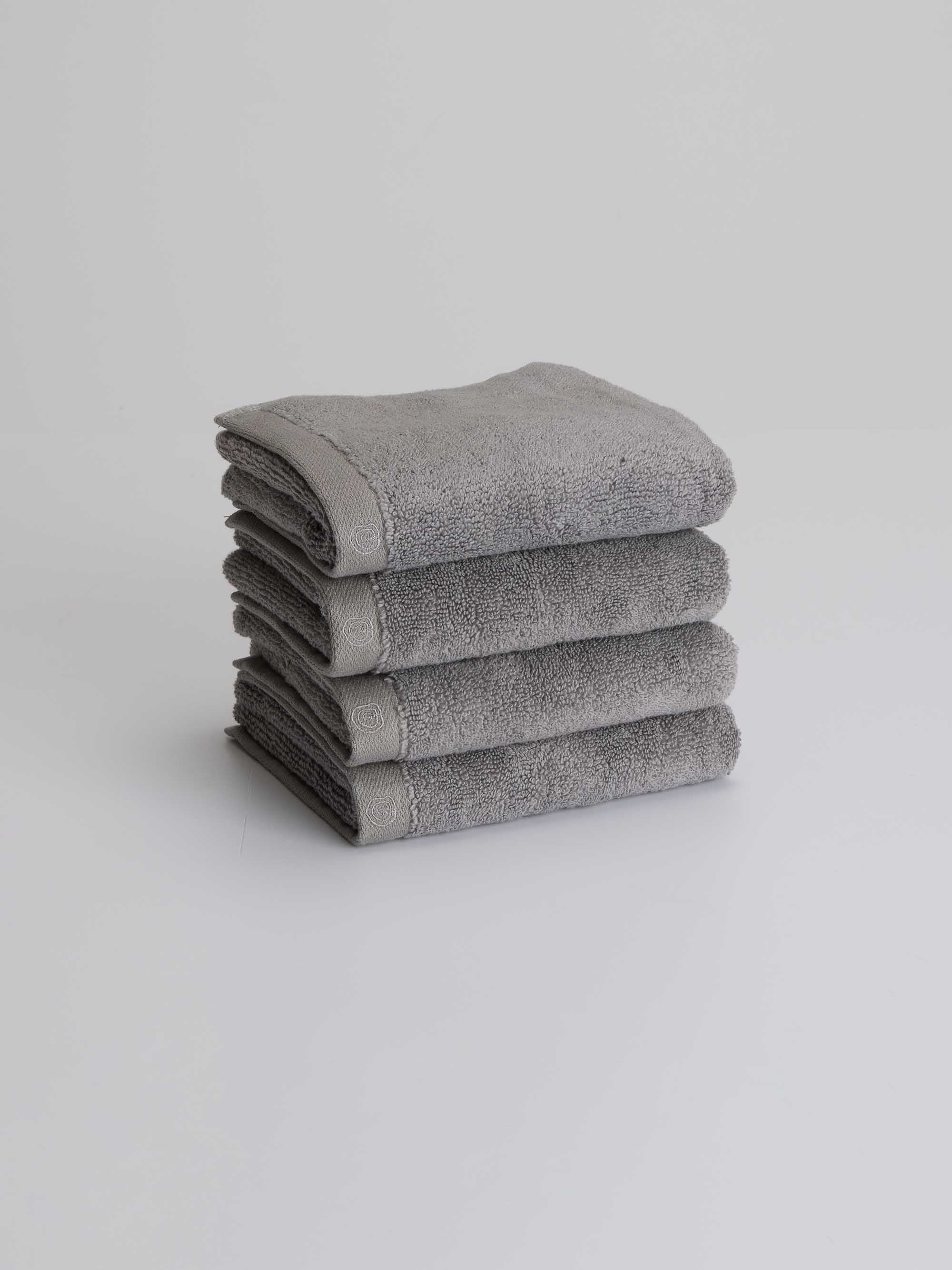 TAKEANAP bamboo zero-twist bath towel in gray on a shelf