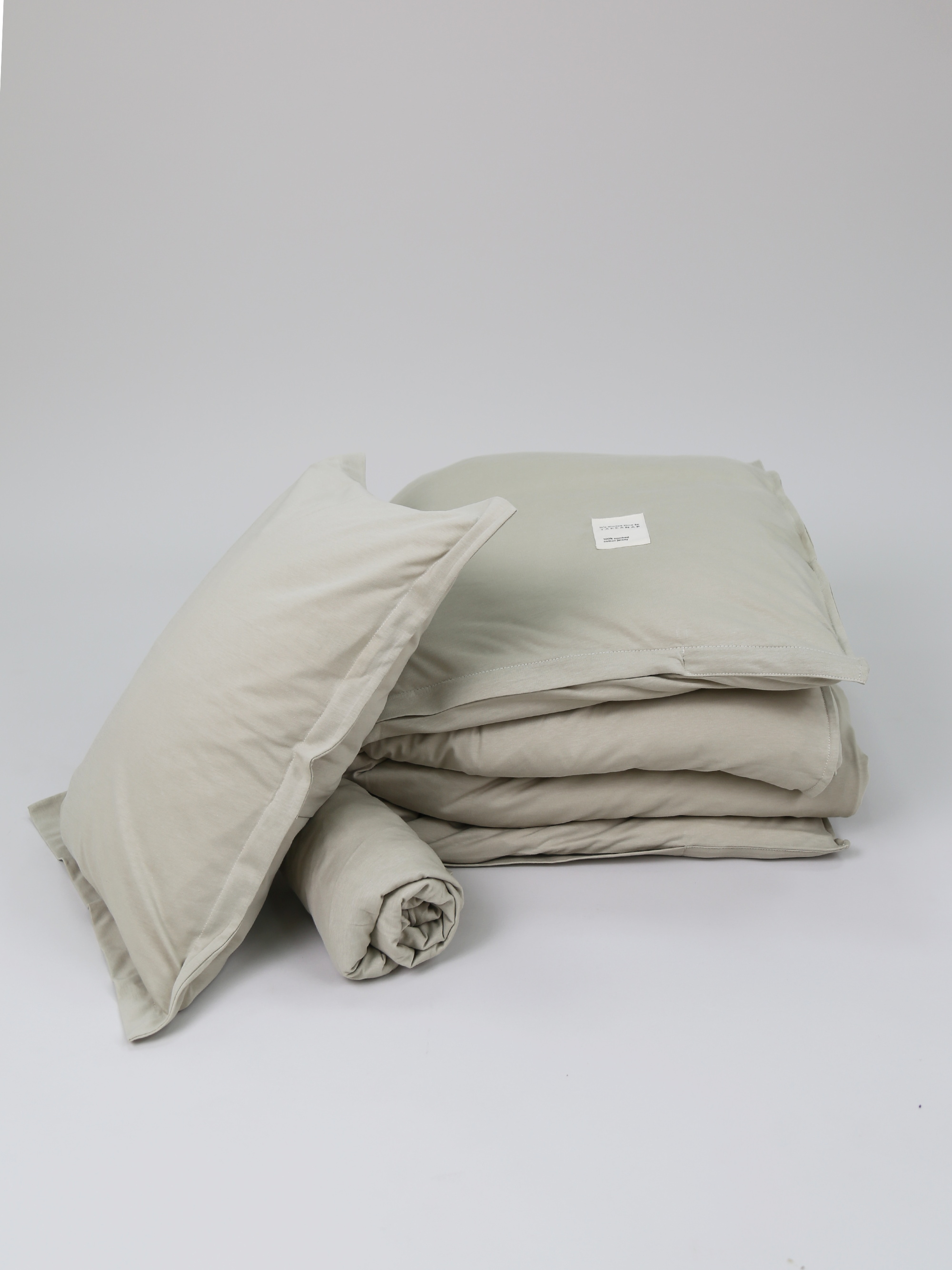 TAKEANAP Oxford jersey toddler bedding set in pistachio in a crib